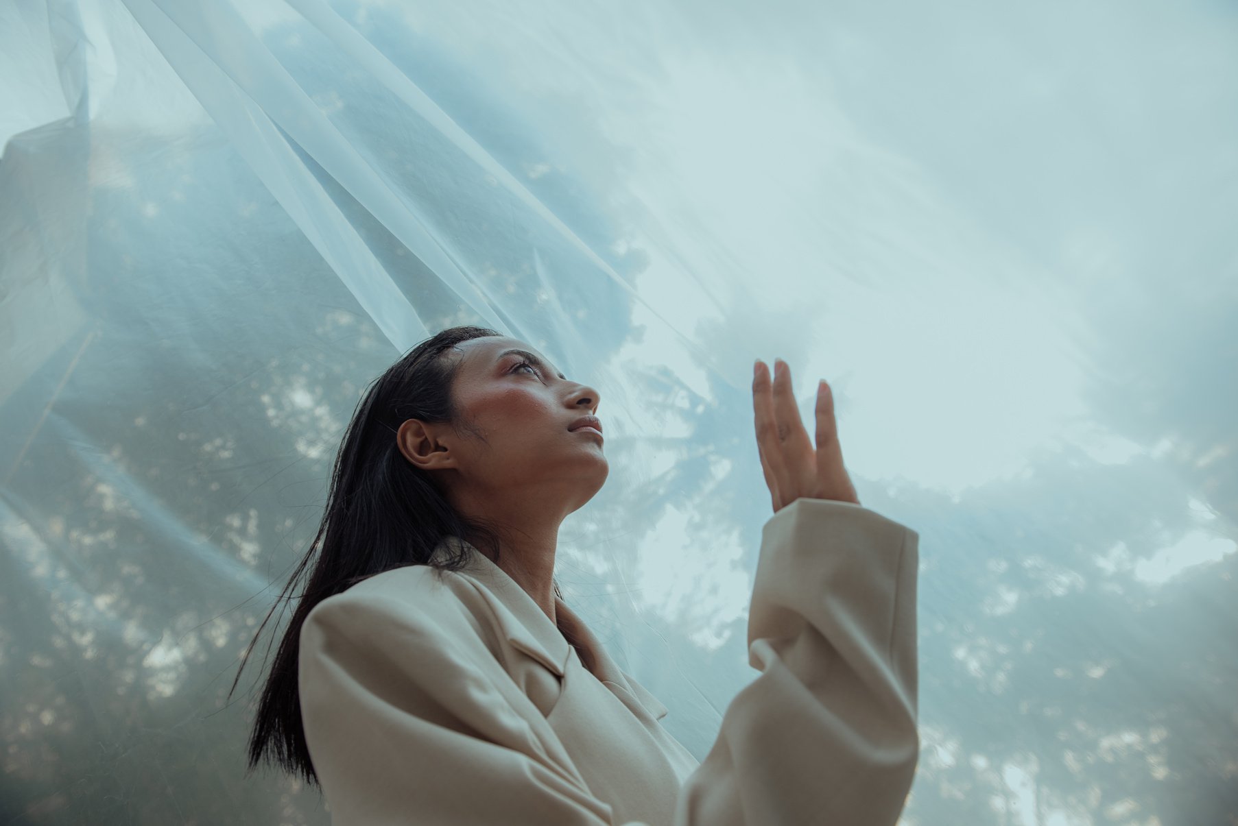 Woman in Suit with Plastic Wrap Background